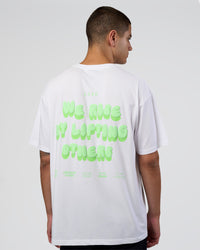 Man wearing Together We Rise FLXCotton Oversized Tee - White-Solar Lime | Model:Zoran | Size:L | Thumbnail Index: 0
