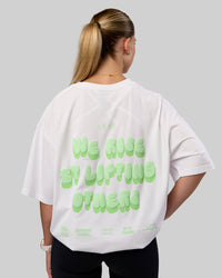 Woman wearing Together We Rise FLXCotton Oversized Tee - White-Solar Lime | Model:Myrte | Size:L | Thumbnail Index: 2