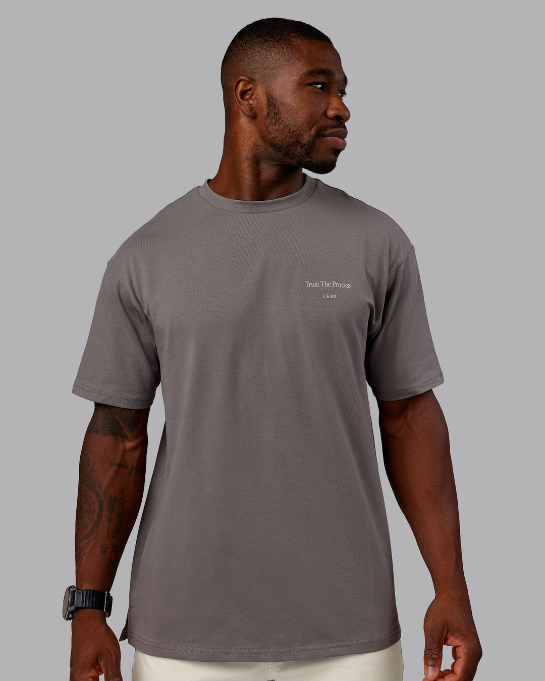 Man wearing Trust The Process 2.0 FLXCotton Tee Oversize - Storm Front-Shale Beige | Model:Sam | Size:L - view 4