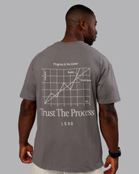 Man wearing Trust The Process 2.0 FLXCotton Tee Oversize - Storm Front-Shale Beige | Model:Sam | Size:L | Thumbnail Index: 1