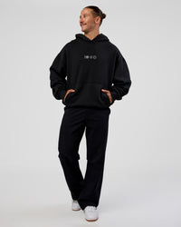 Man wearing Trust The Process Unisex Oversized Hoodie - Black-White | Model:Jaiden | Size:L | Thumbnail Index: 5