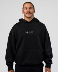 Man wearing Trust The Process Unisex Oversized Hoodie - Black-White | Model:Jaiden | Size:L | Thumbnail Index: 2