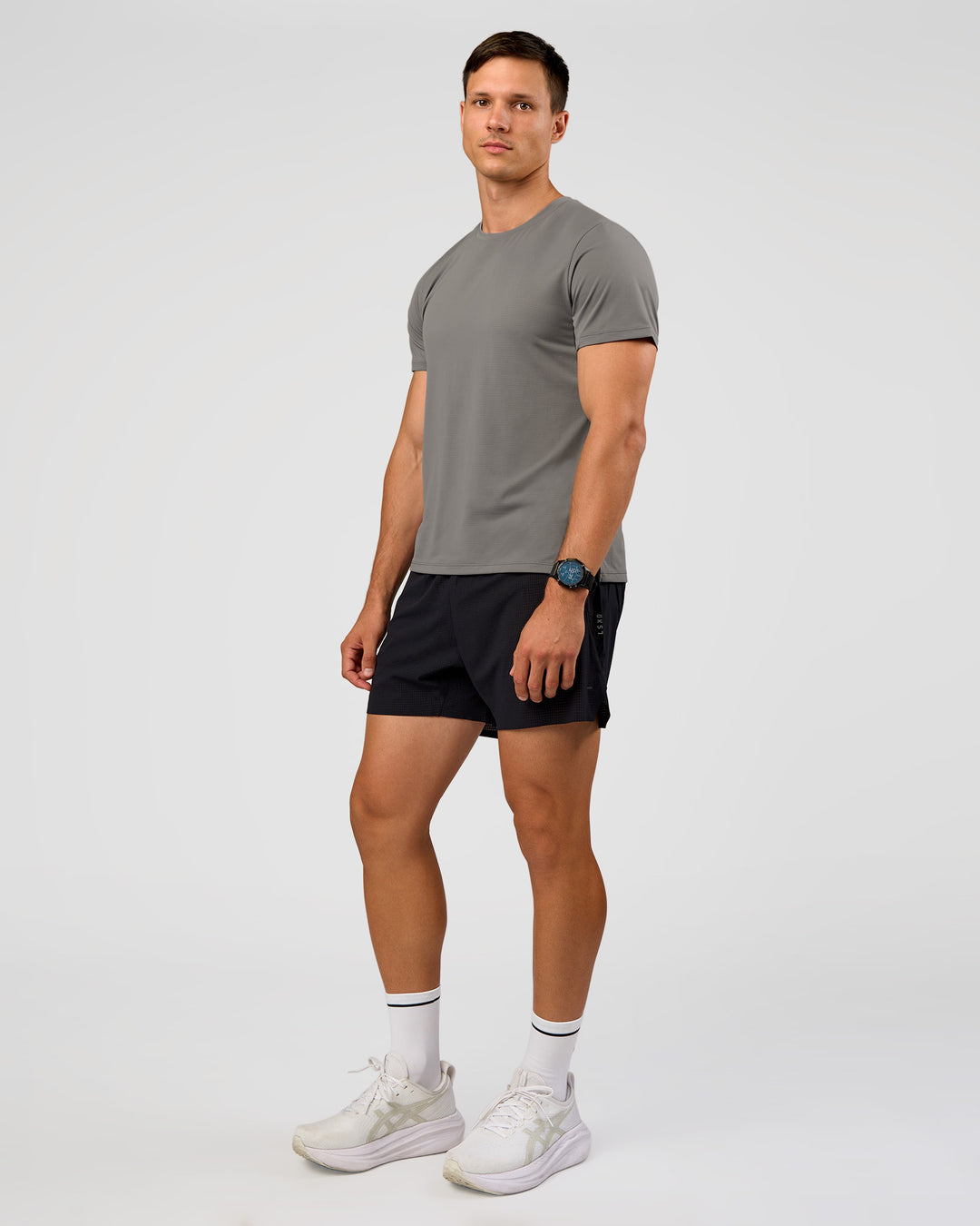Man wearing UltraAir 5" Lined Performance Short  - Black-Reflective | Model:Liam | Size:L - view 7