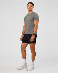 Man wearing UltraAir 5" Lined Performance Short  - Black-Reflective | Model:Liam | Size:L | Thumbnail Index: 6