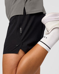 Man wearing UltraAir 5" Lined Performance Short  - Black-Reflective | Model:Liam | Size:L | Thumbnail Index: 2