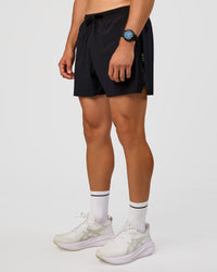 Man wearing UltraAir 5" Lined Performance Short  - Black-Reflective | Model:Liam | Size:L | Thumbnail Index: 7