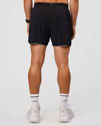 Man wearing UltraAir 5" Lined Performance Short  - Black-Reflective | Model:Liam | Size:L | Thumbnail Index: 3