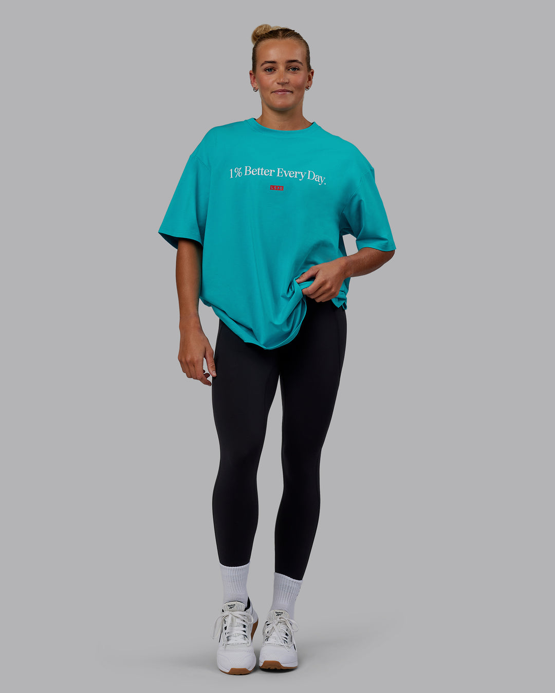 Woman wearing Unisex 1% Better FLXCotton Tee Oversize - Blue Bird-White - view 11