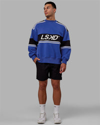 Man wearing Unisex A-Team Sweater Oversize - Power Cobalt-Black | Thumbnail Index: 8