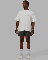 Man wearing Unisex Enjoy The Journey Heavyweight Tee Oversize - Off White-Multi | Thumbnail Index: 7