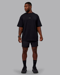 Man wearing Unisex Leg It FLXCotton Tee Oversize - Black-Volt | Thumbnail Index: 11