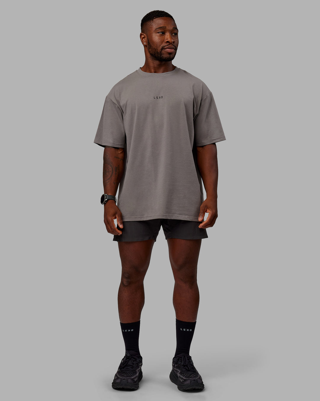 Man wearing Unisex Leg It FLXCotton Tee Oversize - Storm Front-Black - view 8