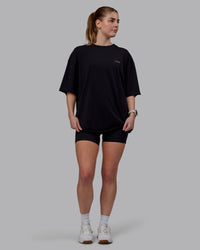 Woman wearing Unisex Lift-Up FLXCotton Tee Oversize - Black-Fuschia Pink | Thumbnail Index: 8