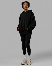 Woman wearing Unisex Love The Run Hoodie Oversize - Black-White | Thumbnail Index: 4