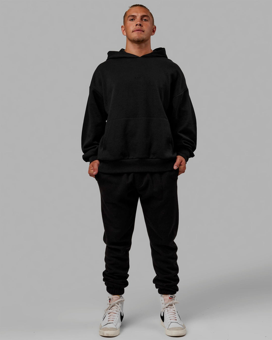 Man wearing Unisex MVP Hoodie Oversize - Black - view 7
