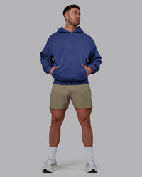 Man wearing Unisex MVP Hoodie Oversize - Future Dusk | Thumbnail Index: 5