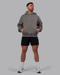 Man wearing Unisex MVP Hoodie Oversize - Storm Front | Thumbnail Index: 7