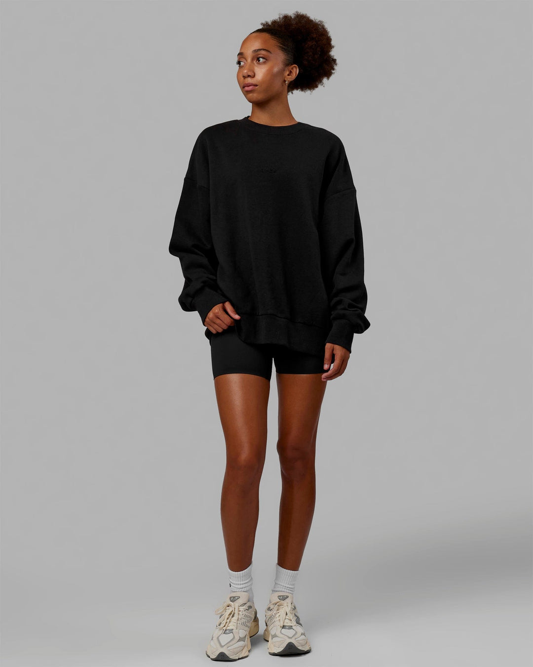 Woman wearing Unisex MVP Sweater Oversize - Black - view 7