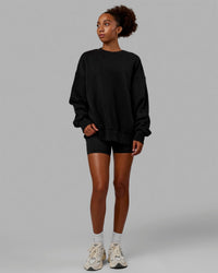 Woman wearing Unisex MVP Sweater Oversize - Black | Thumbnail Index: 6