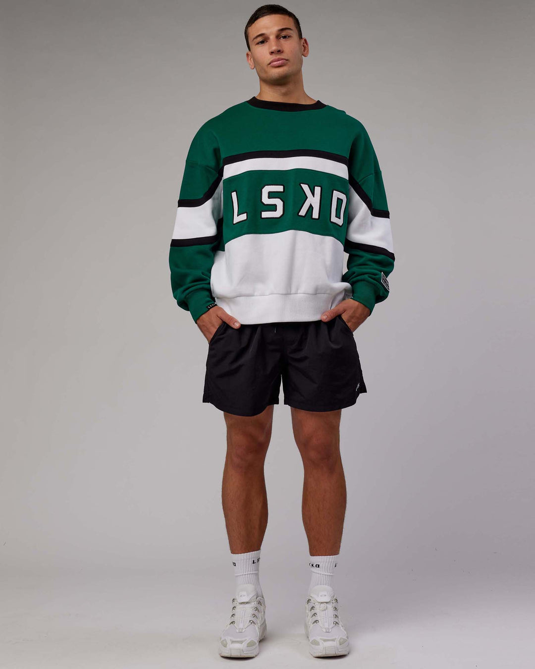 Man wearing Unisex PrimeTime Sweater Oversize - Malachite-White - view 9