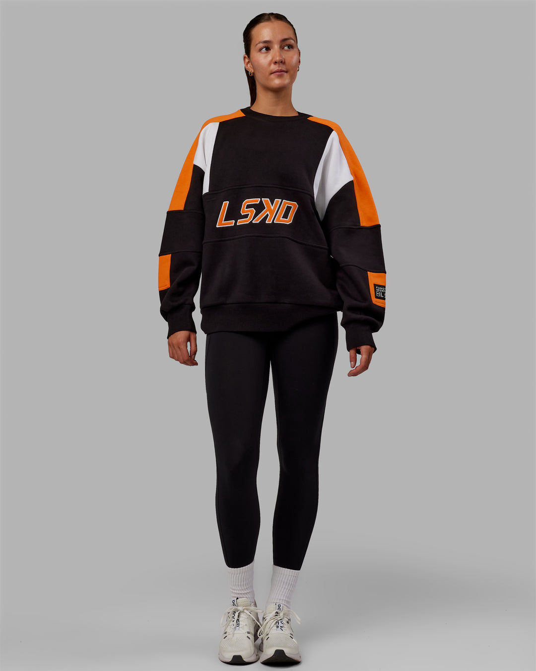 Woman wearing Unisex Slam Sweater Oversize - Black-Ultra Orange - view 9