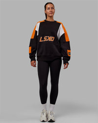 Woman wearing Unisex Slam Sweater Oversize - Black-Ultra Orange | Thumbnail Index: 8