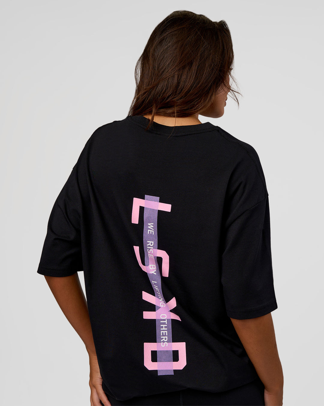 Woman wearing Unisex Strike Through FLXCotton Tee Oversize - Black-Candy Pink | Model:Kirstyn | Size:L - view 3