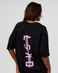 Woman wearing Unisex Strike Through FLXCotton Tee Oversize - Black-Candy Pink | Model:Kirstyn | Size:L | Thumbnail Index: 2