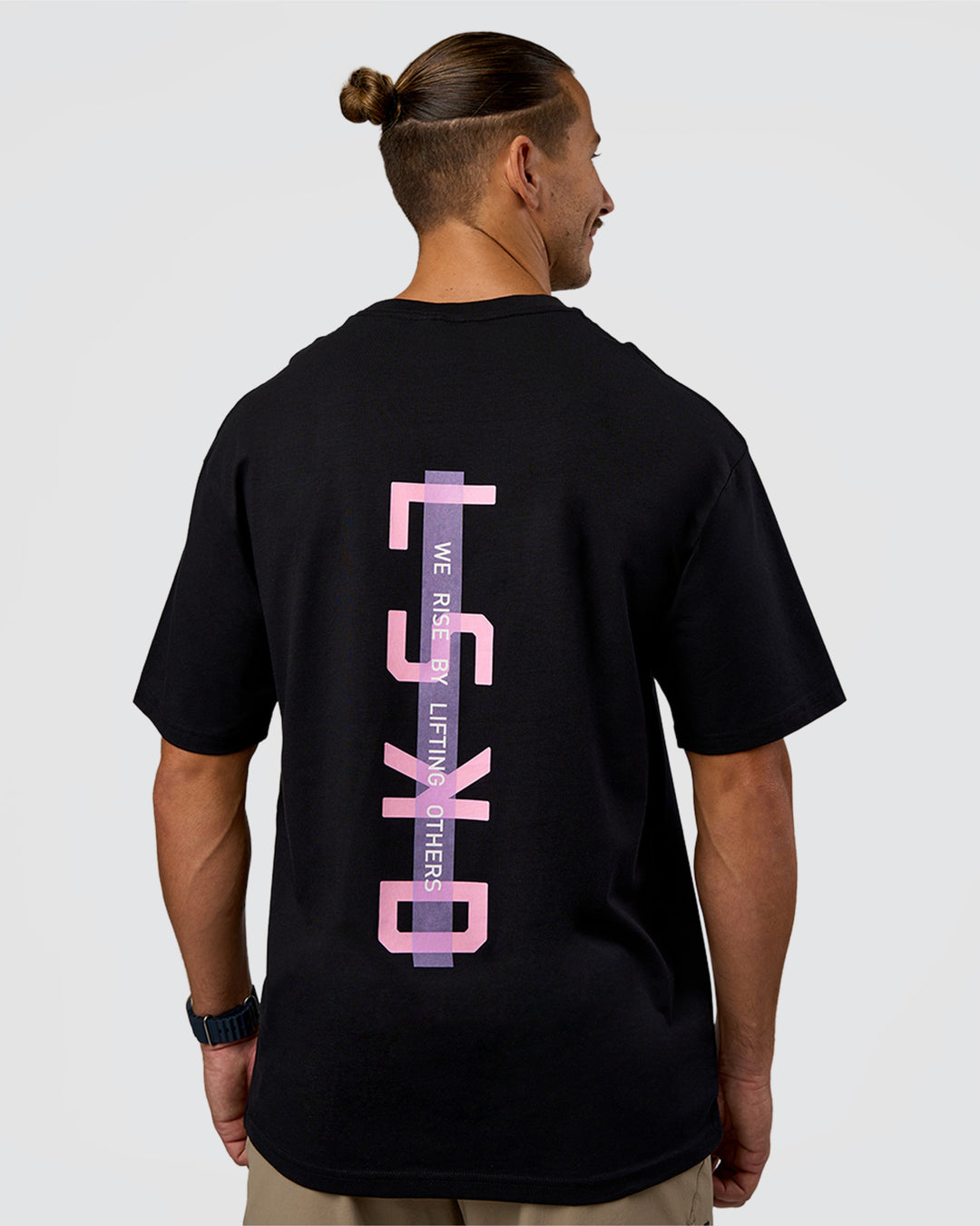 Man wearing Unisex Strike Through FLXCotton Tee Oversize - Black-Candy Pink | Model:Jaiden | Size:L - view 1