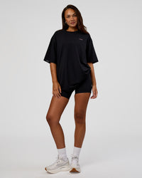 Woman wearing Unisex Strike Through FLXCotton Tee Oversize - Black-Candy Pink | Model:Kirstyn | Size:L | Thumbnail Index: 6
