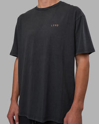Man wearing Unisex Strike Through FLXCotton Tee Oversize - Black Washed-Cantaloupe | Model:Brandon | Size:L | Thumbnail Index: 6