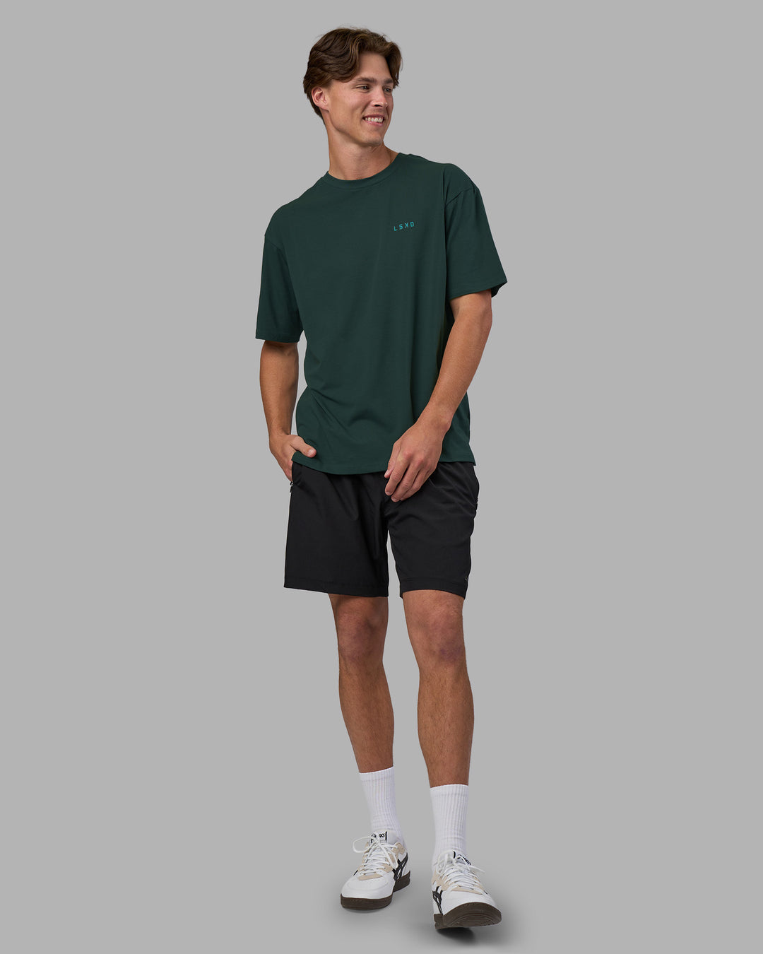 Man wearing Unisex Strike Through FLXCotton Tee Oversize - Vital Green-Alexandrite | Model:Brandon | Size:L - view 4