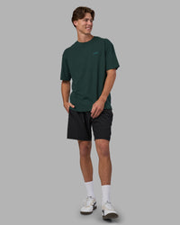 Man wearing Unisex Strike Through FLXCotton Tee Oversize - Vital Green-Alexandrite | Model:Brandon | Size:L | Thumbnail Index: 3