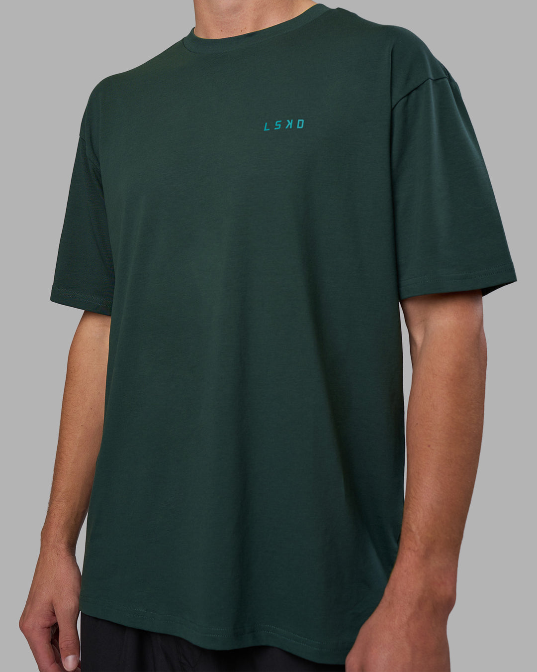 Man wearing Unisex Strike Through FLXCotton Tee Oversize - Vital Green-Alexandrite | Model:Brandon | Size:L - view 6