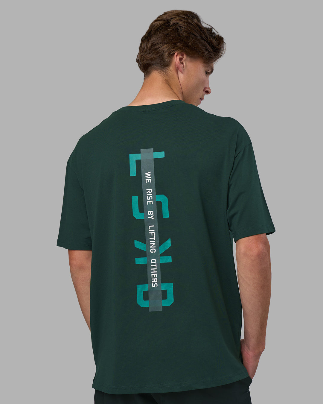 Man wearing Unisex Strike Through FLXCotton Tee Oversize - Vital Green-Alexandrite | Model:Brandon | Size:L - view 5