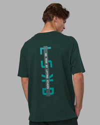 Man wearing Unisex Strike Through FLXCotton Tee Oversize - Vital Green-Alexandrite | Model:Brandon | Size:L | Thumbnail Index: 4