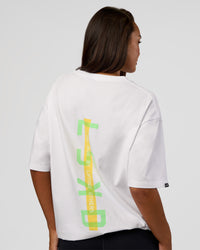 Woman wearing Unisex Strike Through FLXCotton Tee Oversize - White-Warm Apricot | Model:Kirstyn | Size:L | Thumbnail Index: 3