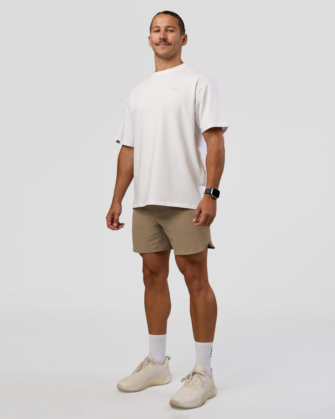 Man wearing Unisex Strike Through FLXCotton Tee Oversize - White-Warm Apricot | Model:Jaiden | Size:L - view 5