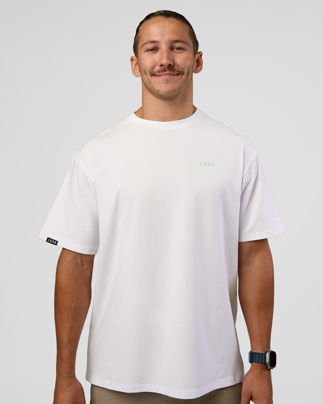 Man wearing Unisex Strike Through FLXCotton Tee Oversize - White-Warm Apricot | Model:Jaiden | Size:L - view 1