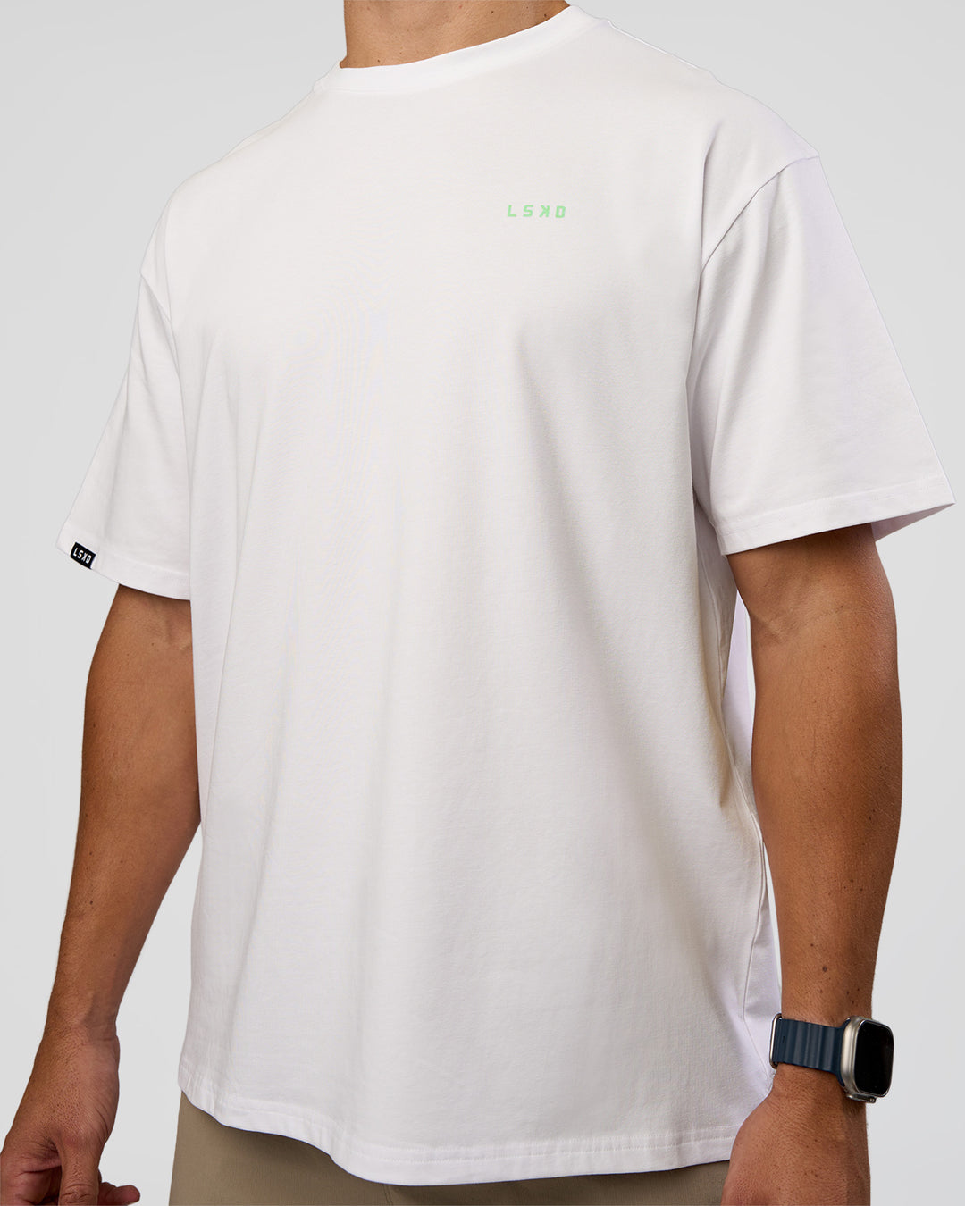 Man wearing Unisex Strike Through FLXCotton Tee Oversize - White-Warm Apricot | Model:Jaiden | Size:L - view 6