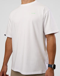 Man wearing Unisex Strike Through FLXCotton Tee Oversize - White-Warm Apricot | Model:Jaiden | Size:L | Thumbnail Index: 5