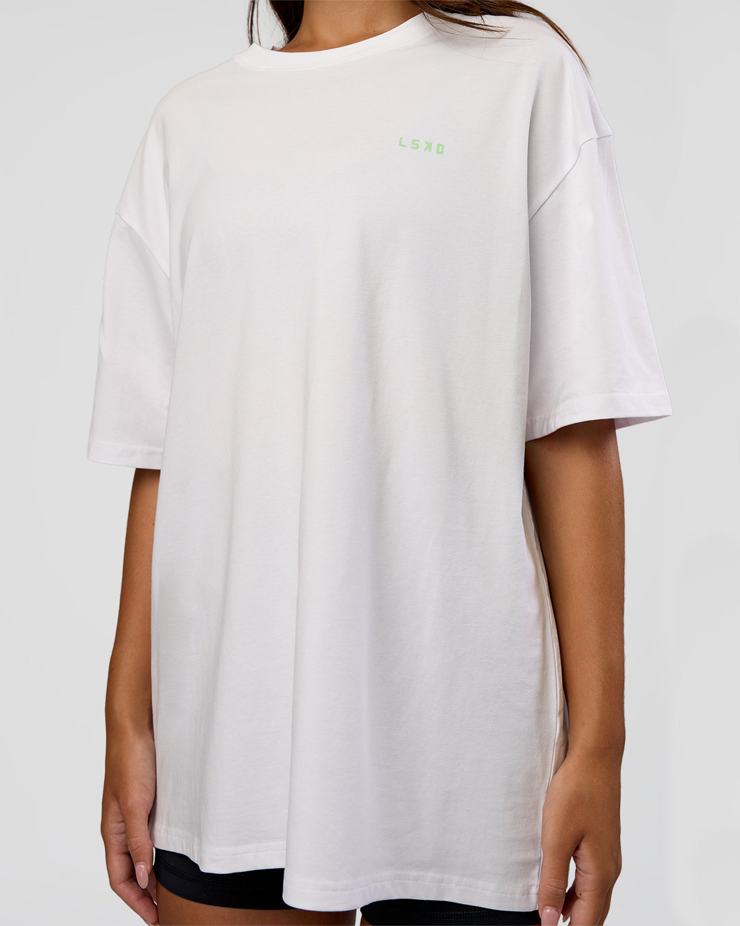 Woman wearing Unisex Strike Through FLXCotton Tee Oversize - White-Warm Apricot | Model:Kirstyn | Size:L - view 8
