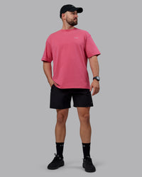 Man wearing Unisex Washed Empower Tee Oversize - Berry Pink-Pastel Orchid | Thumbnail Index: 5
