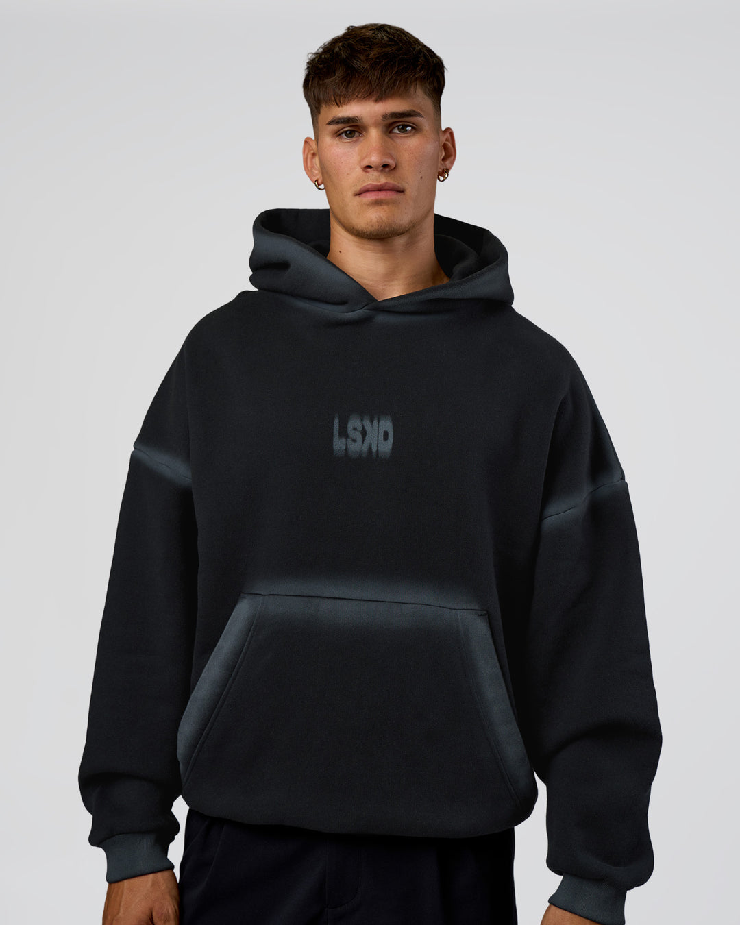 Man wearing Urban Blur Unisex Oversized Hoodie - Black-Dark Storm | Model:Jackson | Size:L - view 2