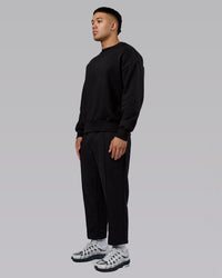 Man wearing Urban Cropped Track Pant - Black| Model:Kaelyb | Size:L | Thumbnail Index: 1