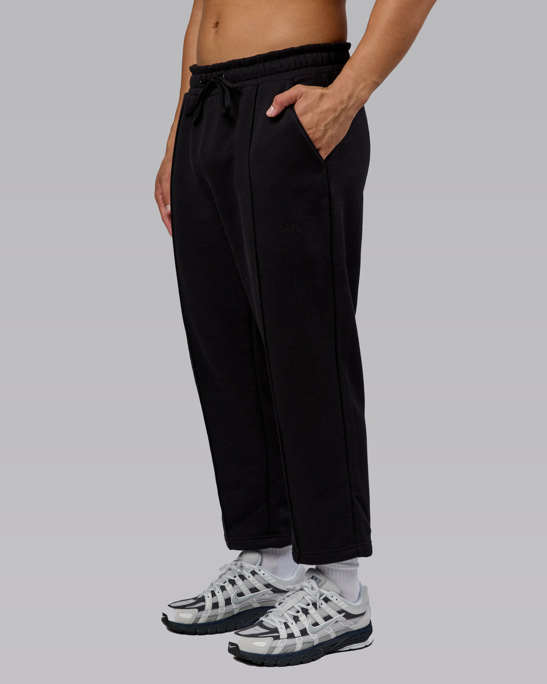 Man wearing Urban Cropped Track Pant - Black| Model:Kaelyb | Size:L - view 1