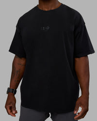Man wearing Variation Heavyweight FLXCotton Oversized Tee - Black-Black | Model:Sam | Size:L | Thumbnail Index: 8