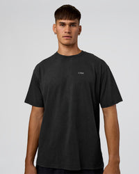 Man wearing We Love This  FLXCotton Oversized Tee - Black Washed-White | Model:Jackson | Size:L | Thumbnail Index: 1