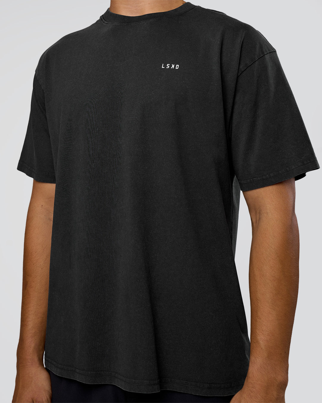 Man wearing We Love This  FLXCotton Oversized Tee - Black Washed-White | Model:Jackson | Size:L - view 7