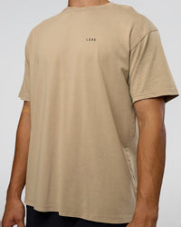 Man wearing We Love This  FLXCotton Oversized Tee - Greige Washed-Black | Model:Jackson | Size:L | Thumbnail Index: 6